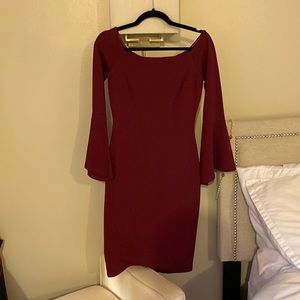 Maroon body conforming dress with bell sleeves